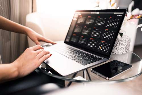 Freelance Woman Working on Her MacBook